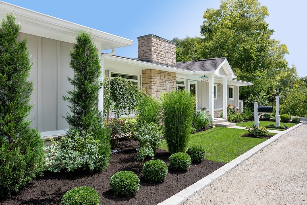 A newly renovated outdoor of a home with fresh landscaping. Renovation done by Epic.