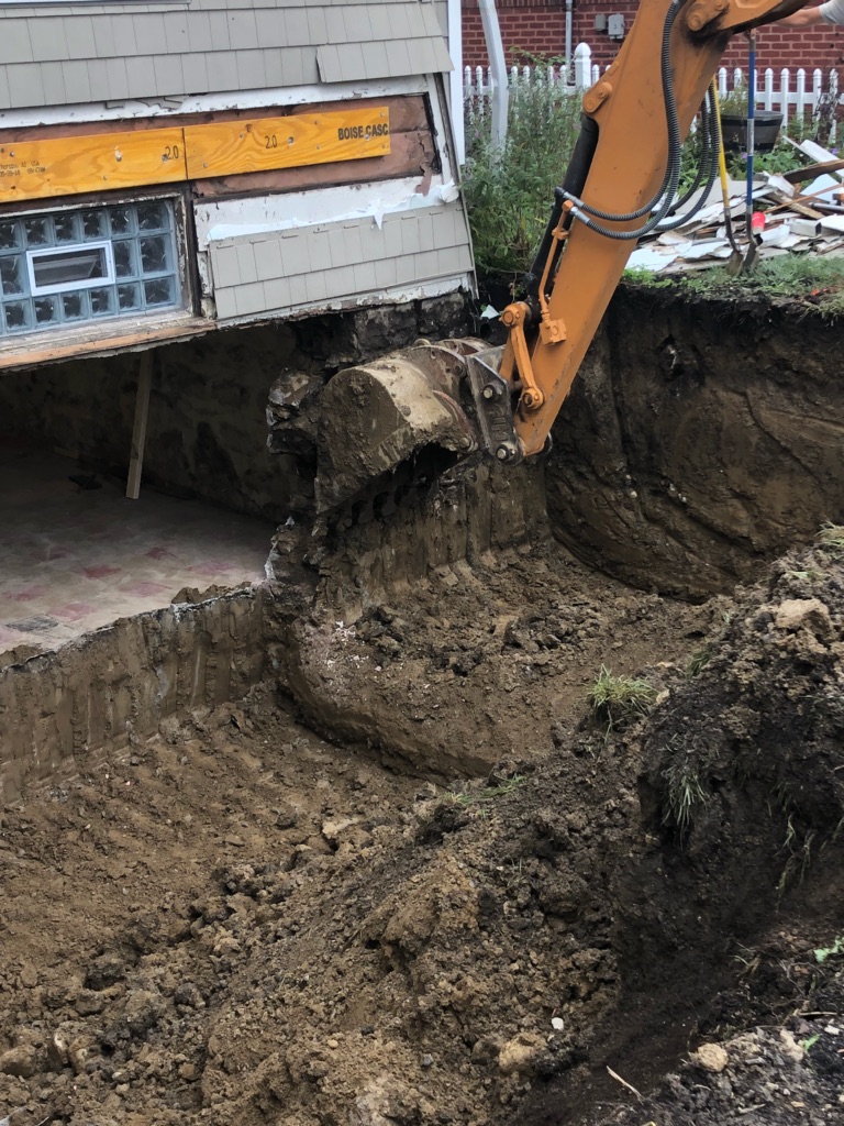 A Grandview renovation being dug out around the home's foundation.