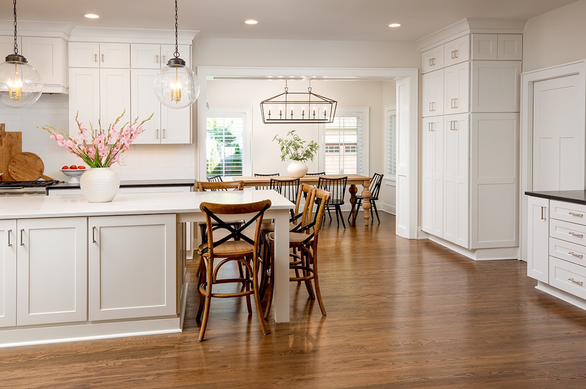 Hardwood floors in a kitchen and dining area.